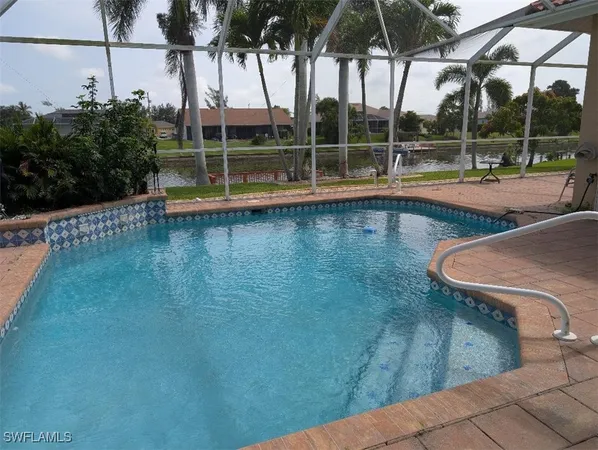 a view of a swimming pool with a patio