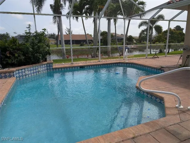 a view of a swimming pool with a patio