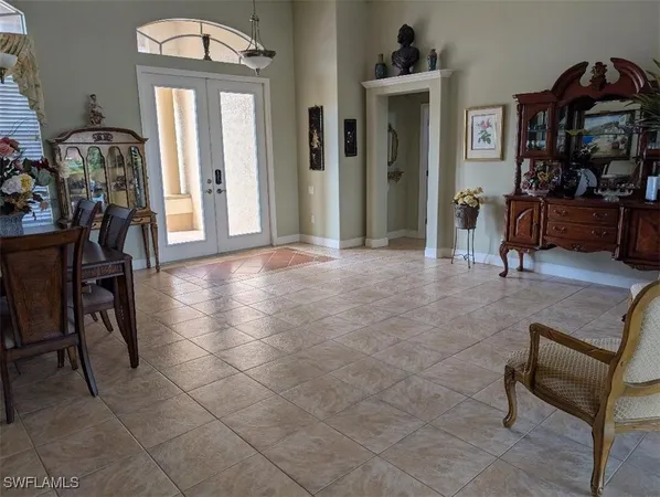 a view of a livingroom with furniture and a hallway