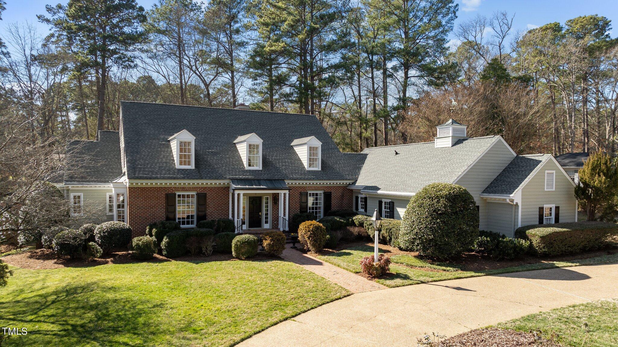 8 Surrey Lane Durham, NC 27707 - Photo 1 of 50 a view of a house with yard patio and sitting area