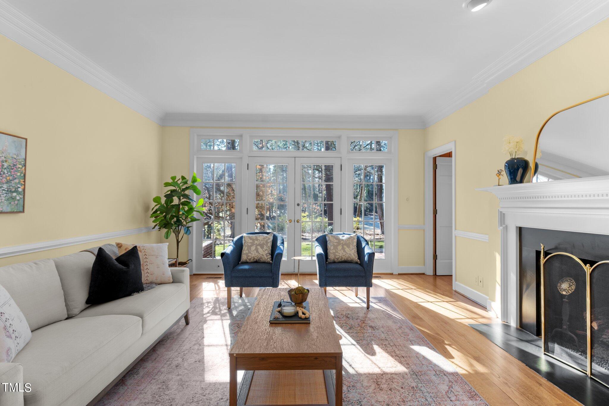 8 Surrey Lane Durham, NC 27707 - Photo 18 of 50 a living room with furniture and a fireplace
