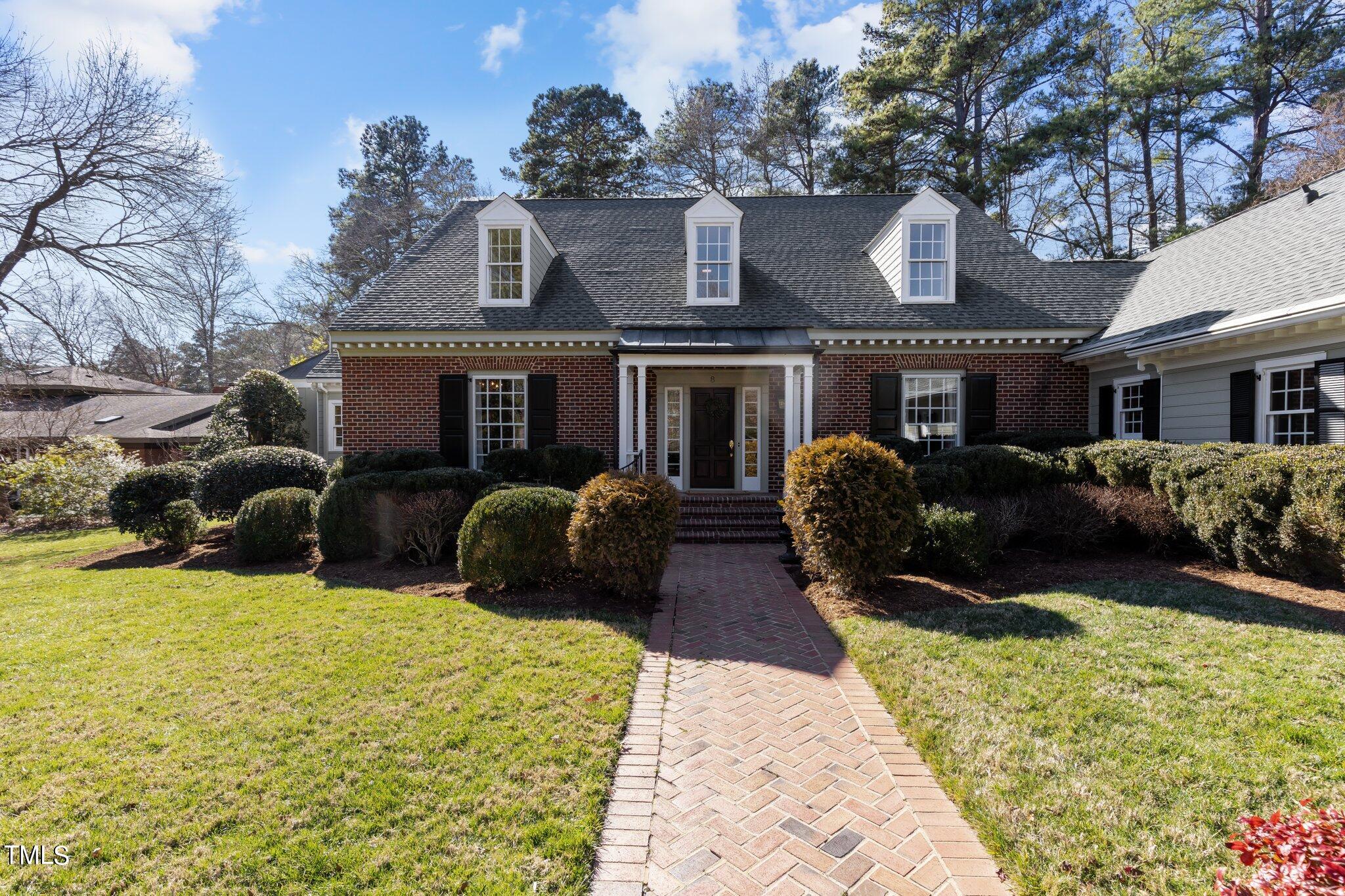 8 Surrey Lane Durham, NC 27707 - Photo 2 of 50 a front view of a house with a yard and outdoor seating