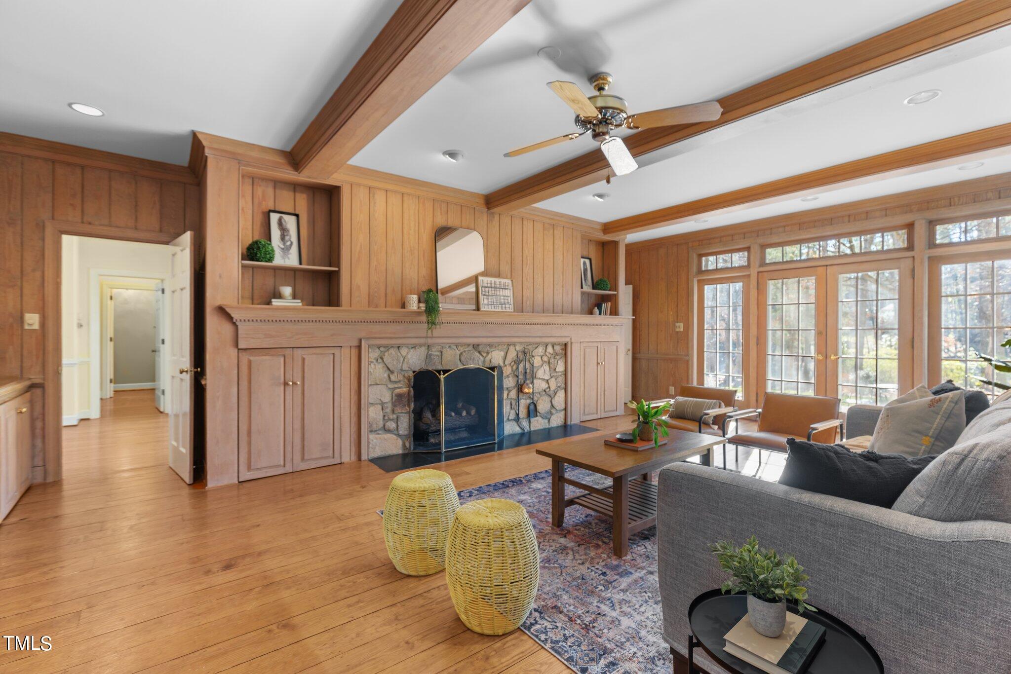 8 Surrey Lane Durham, NC 27707 - Photo 25 of 50 a living room with furniture a fireplace and a large window