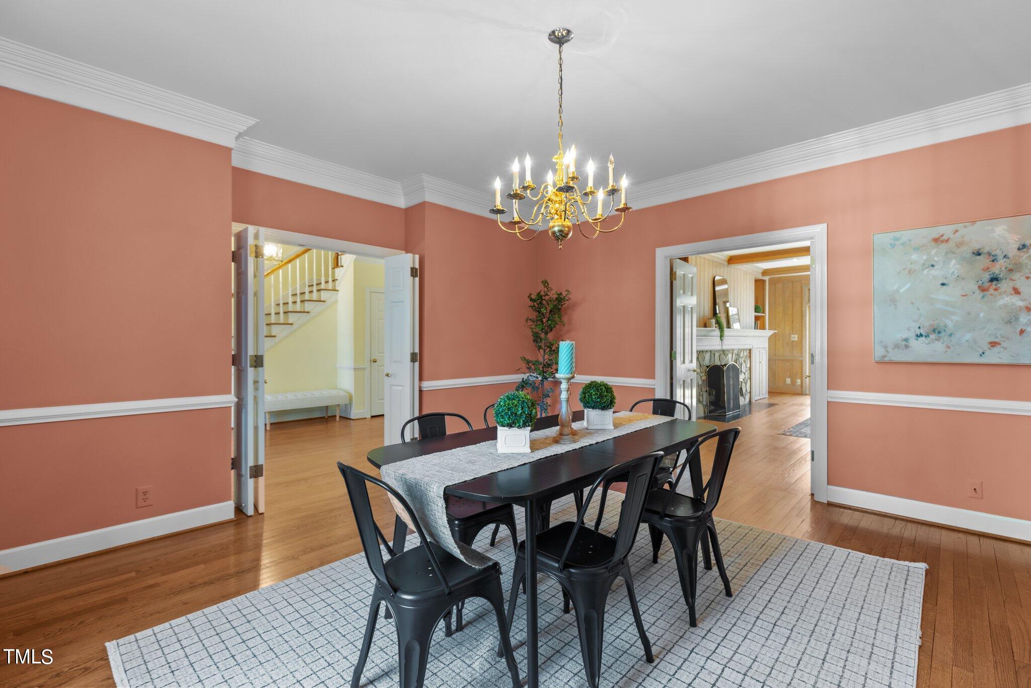 8 Surrey Lane Durham, NC 27707 - Photo 27 of 50 a view of a dining room with furniture wooden floor and a chandelier