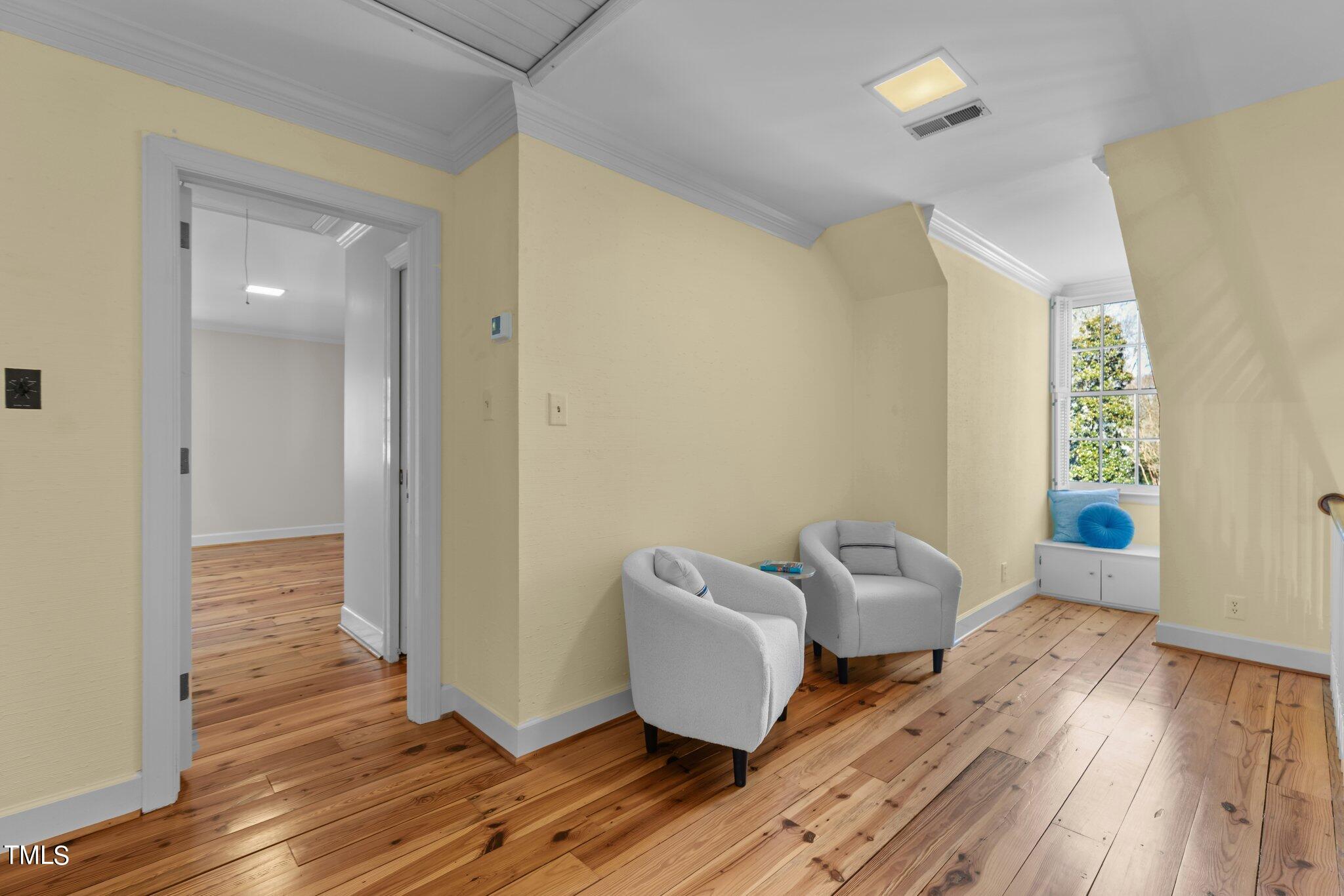 8 Surrey Lane Durham, NC 27707 - Photo 34 of 50 a living room with furniture and a wooden floor