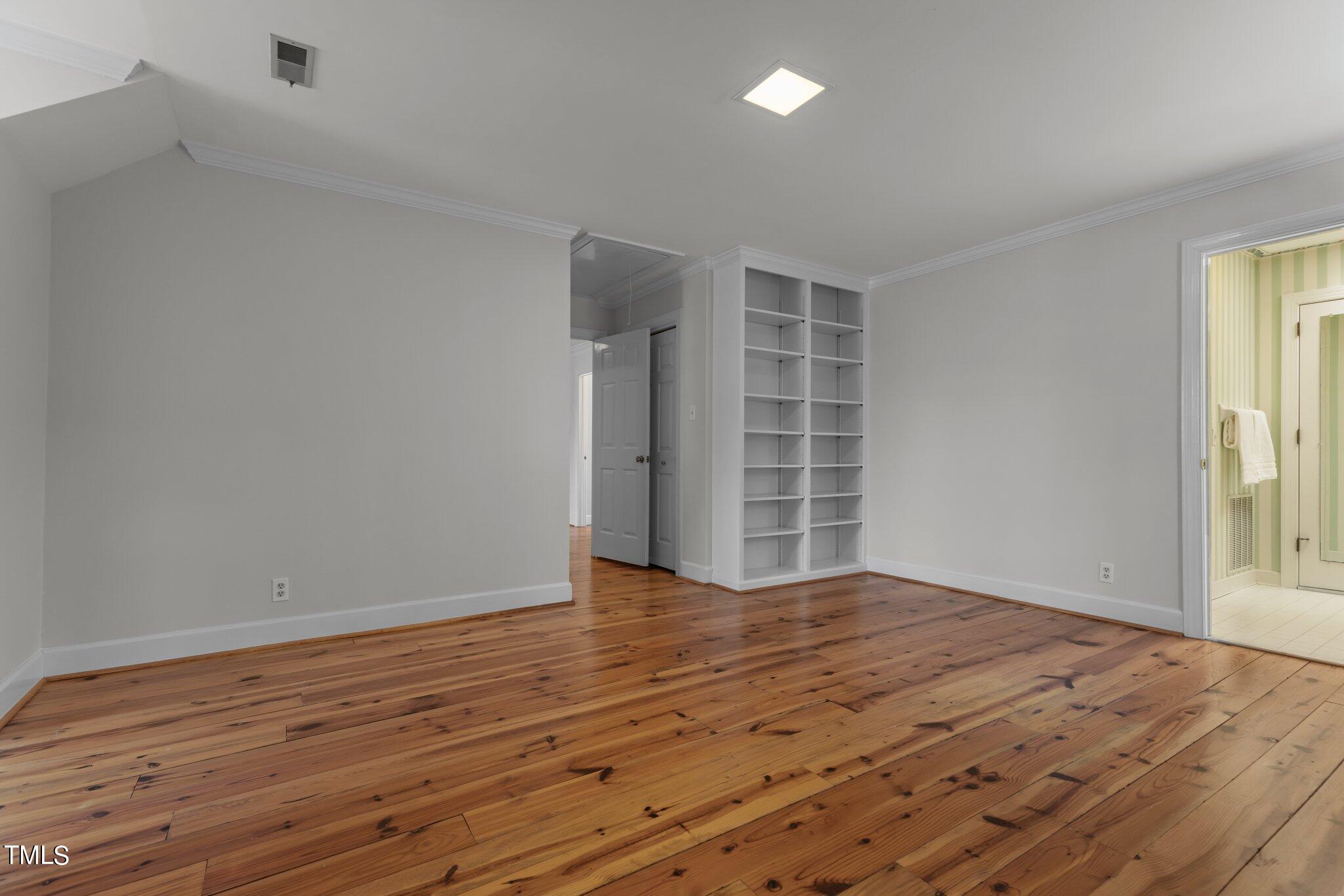 8 Surrey Lane Durham, NC 27707 - Photo 41 of 50 wooden floor in an empty room with a window
