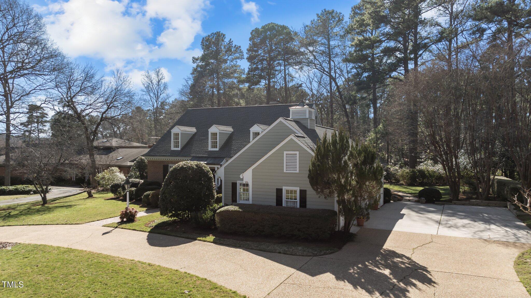 8 Surrey Lane Durham, NC 27707 - Photo 43 of 50 a front view of a house with a yard
