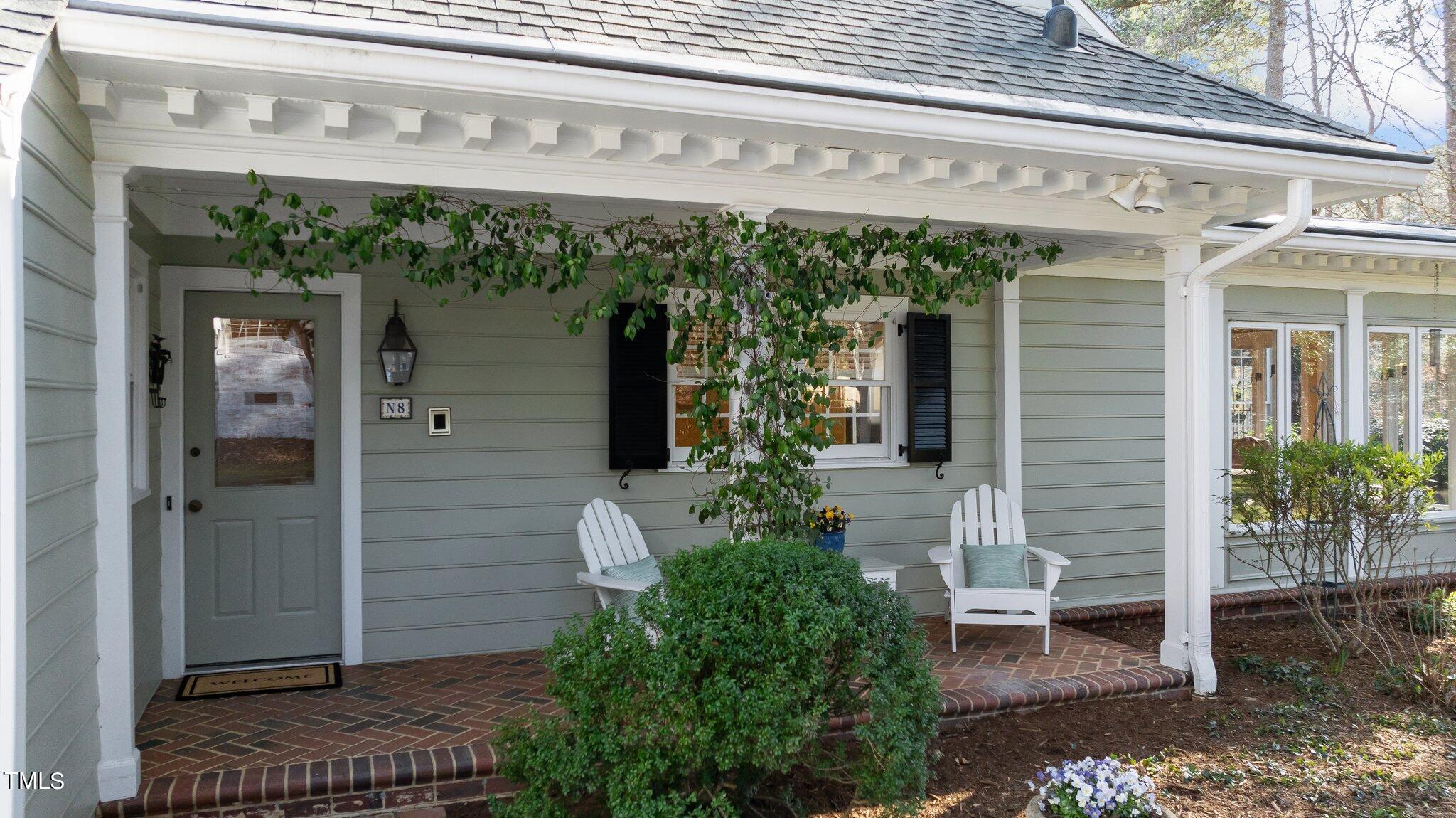8 Surrey Lane Durham, NC 27707 - Photo 44 of 50 front view of a building with potted plants