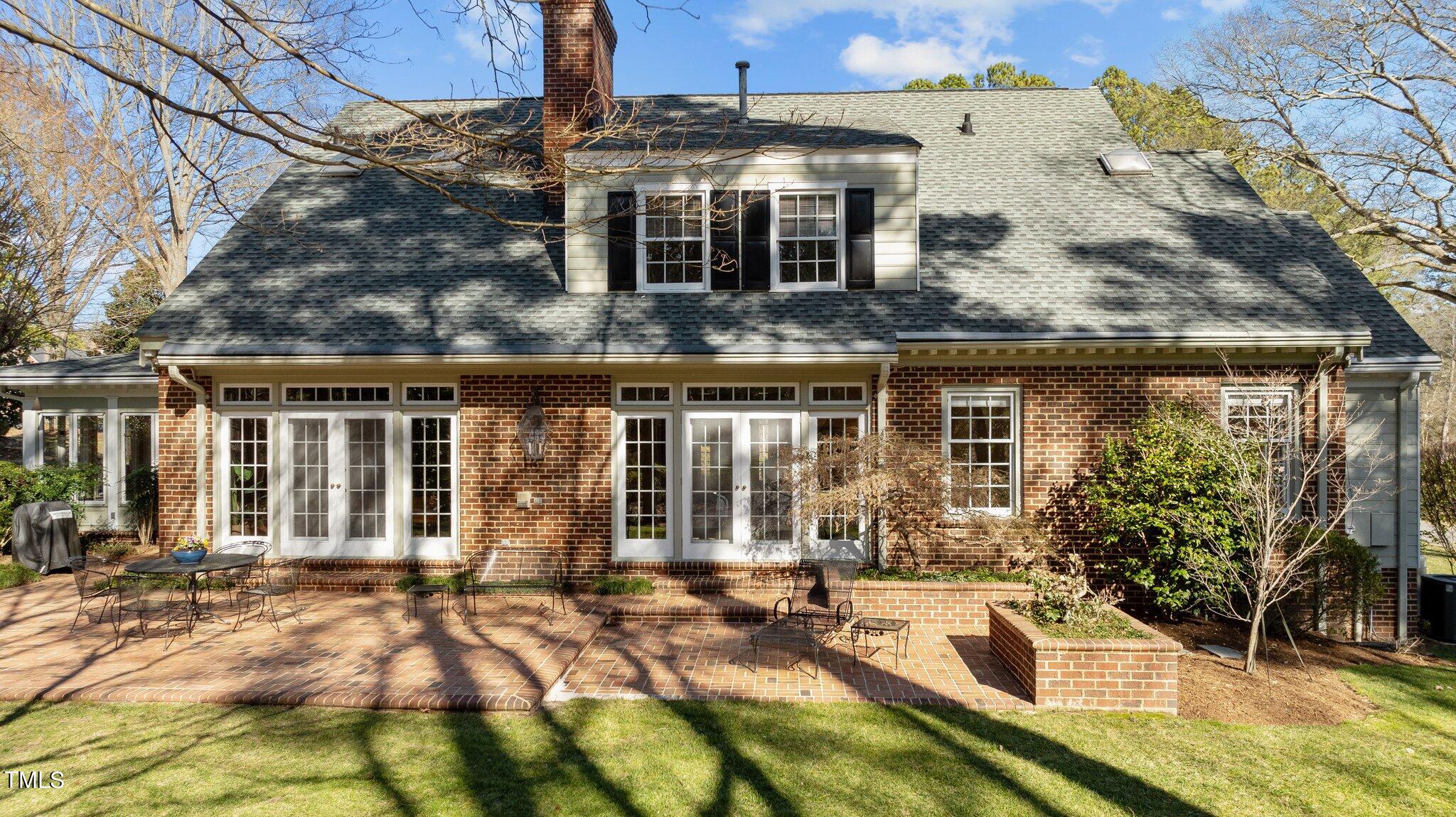8 Surrey Lane Durham, NC 27707 - Photo 47 of 50 a front view of a house with a yard
