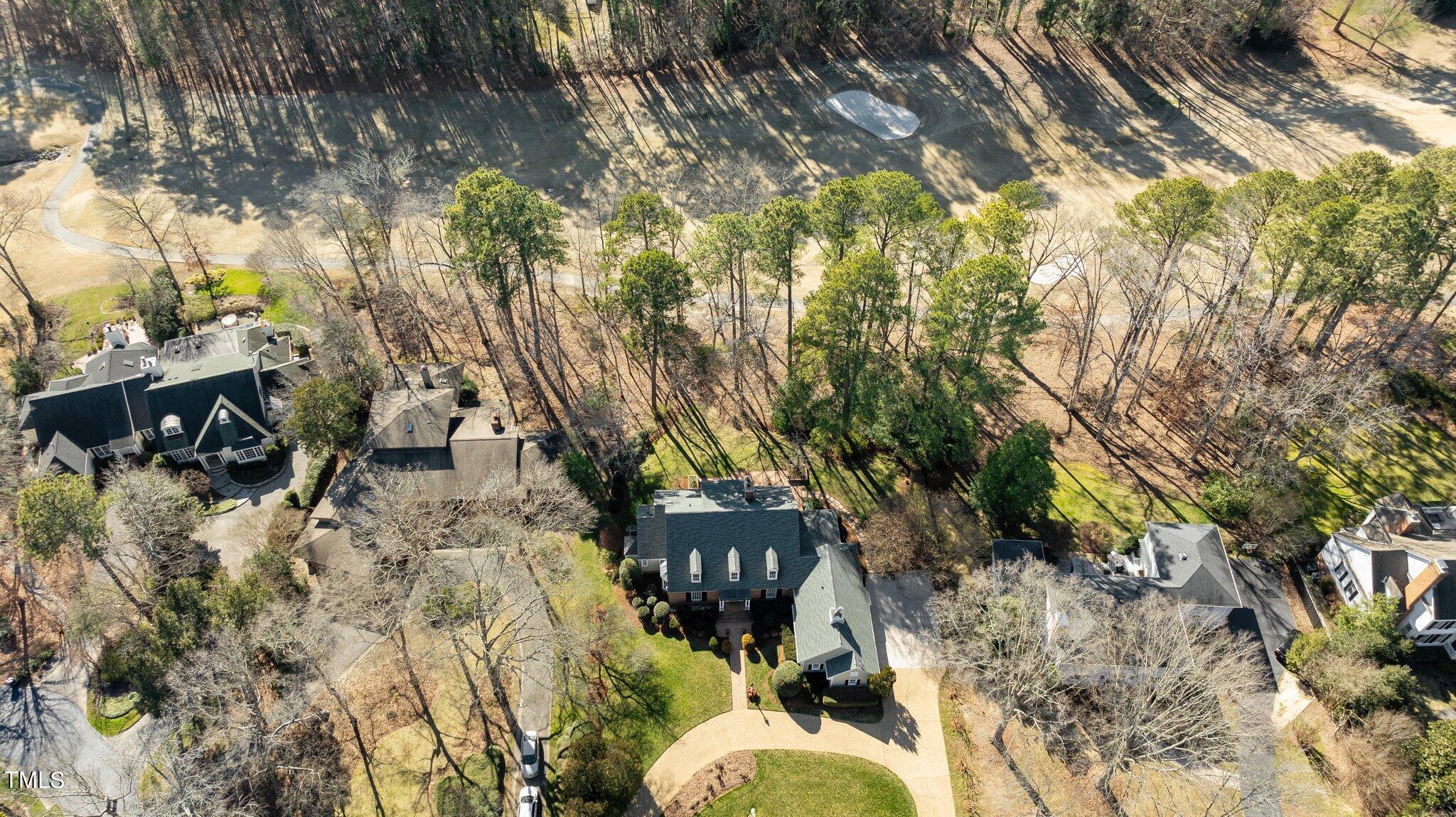 8 Surrey Lane Durham, NC 27707 - Photo 49 of 50 a backyard of a house with table and chairs