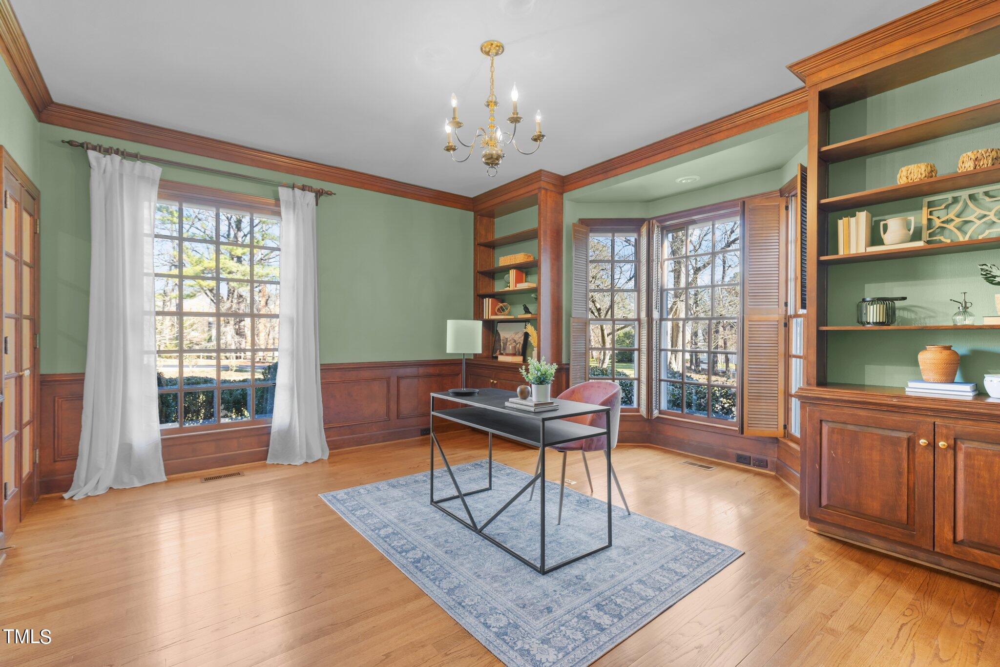 8 Surrey Lane Durham, NC 27707 - Photo 10 of 50 a work room with furniture wooden floor and a chandelier