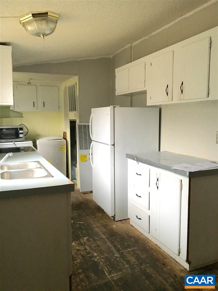 44 Jonquil Road Ruckersville, VA 22968 - Photo 3 of 12 a kitchen with stainless steel appliances a refrigerator a sink and white cabinets