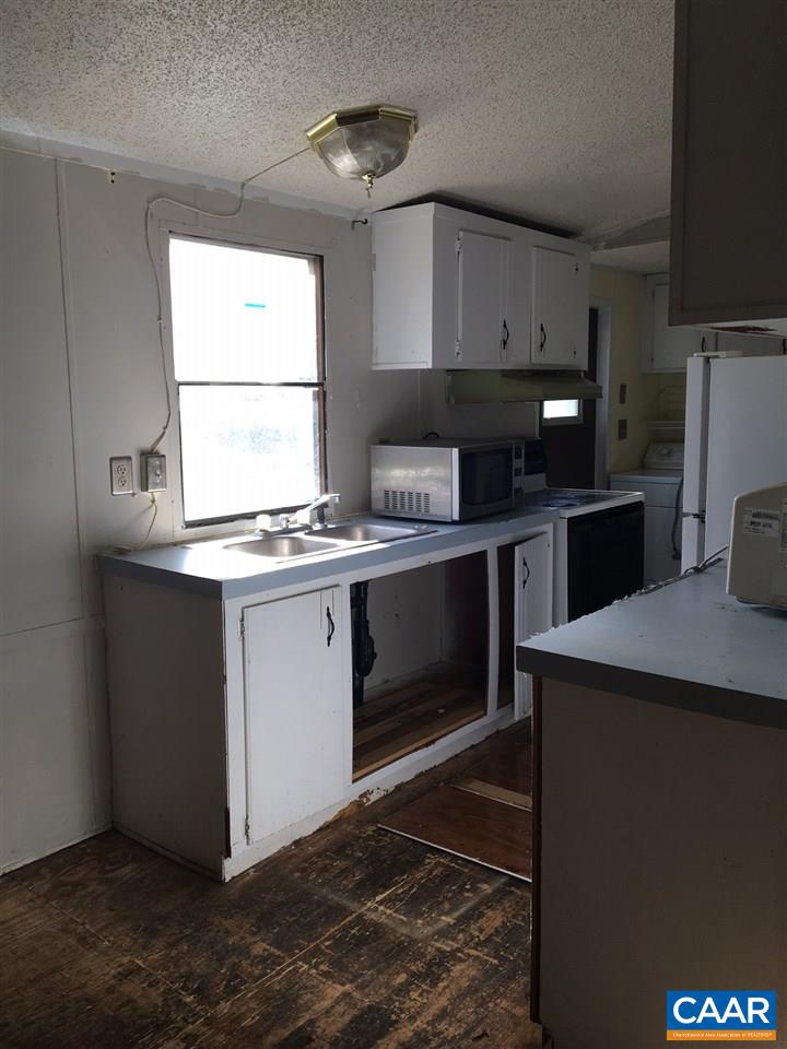 44 Jonquil Road Ruckersville, VA 22968 - Photo 4 of 12 a kitchen with a stove and a microwave