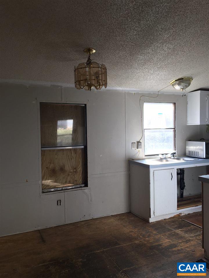 44 Jonquil Road Ruckersville, VA 22968 - Photo 6 of 12 a view of a kitchen with a sink dishwasher and wooden floor