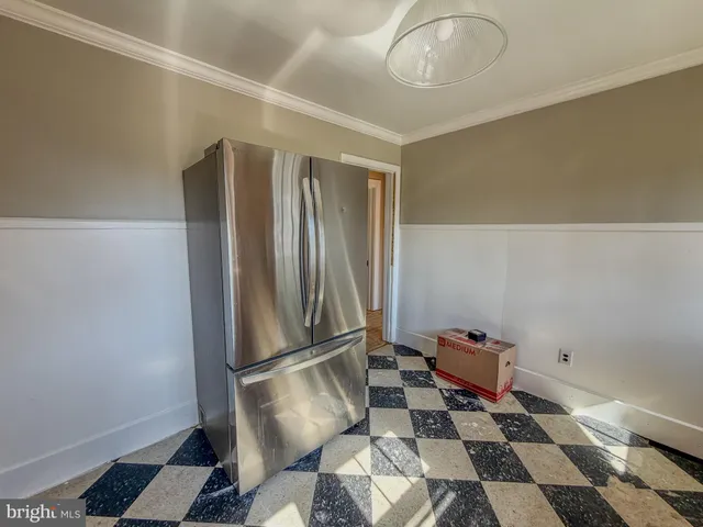 a kitchen with a sink and a refrigerator