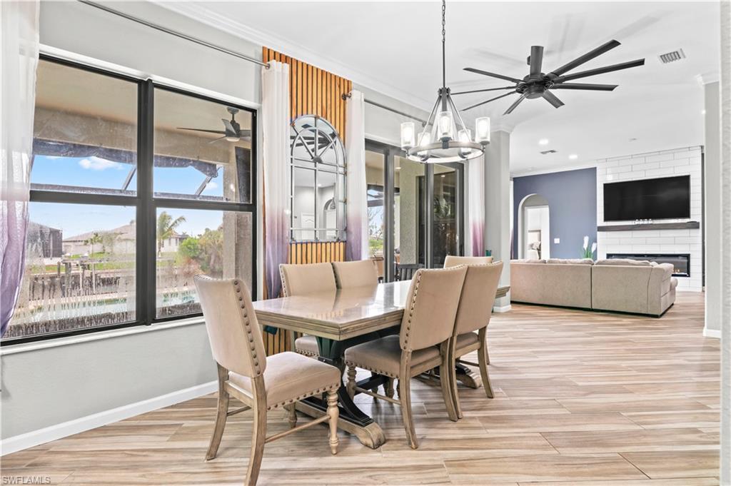 2123 Old Burnt Store Road North Cape Coral, FL 33993 - Photo 16 of 40 a view of a livingroom with furniture and a ceiling fan