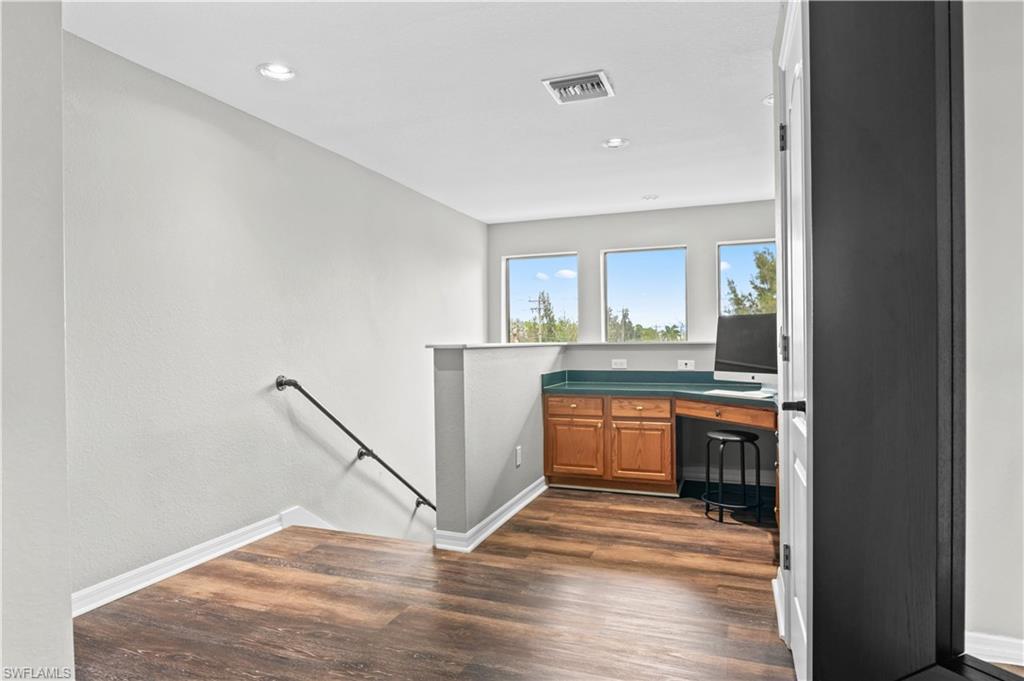 2123 Old Burnt Store Road North Cape Coral, FL 33993 - Photo 27 of 40 a view of a kitchen from the hallway