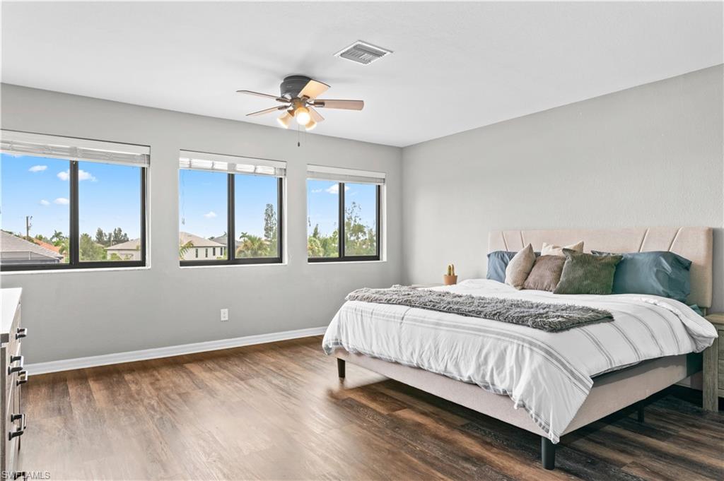 2123 Old Burnt Store Road North Cape Coral, FL 33993 - Photo 28 of 40 a bedroom with a large bed and a window