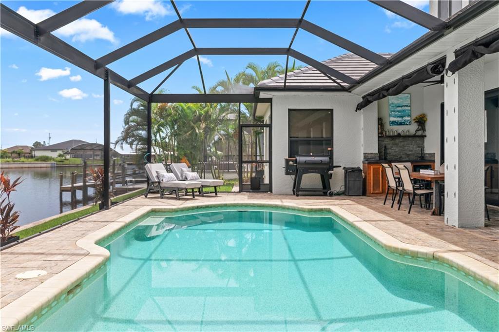 2123 Old Burnt Store Road North Cape Coral, FL 33993 - Photo 34 of 40 a view of a swimming pool with a patio