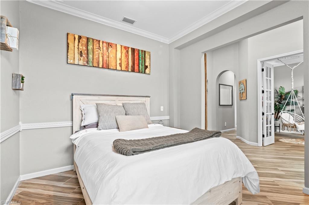 2123 Old Burnt Store Road North Cape Coral, FL 33993 - Photo 7 of 40 a bedroom with a bed and a window