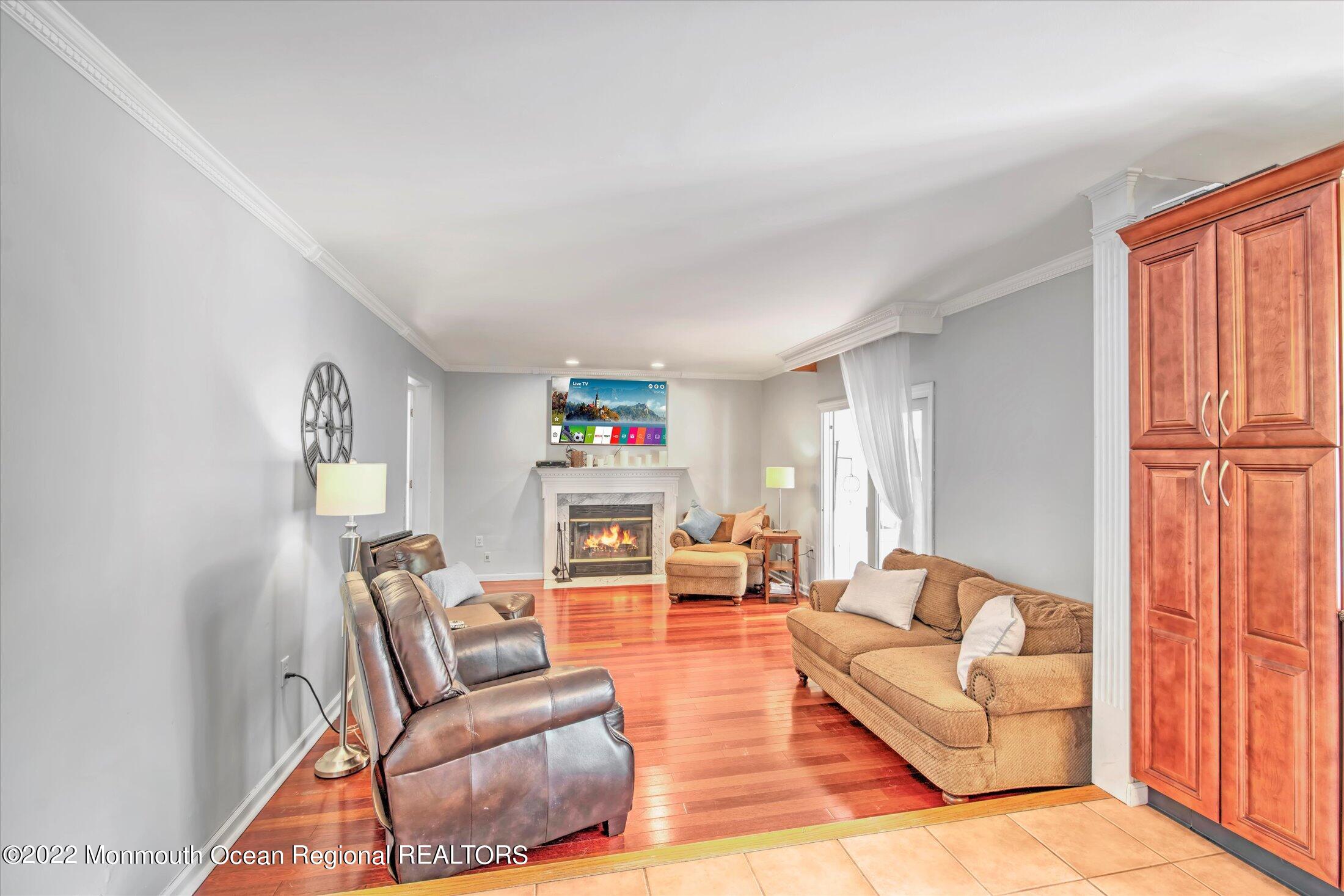 10 MacIntosh Court Jackson, NJ 08527 - Photo 12 of 49 a living room with furniture and a wooden floor