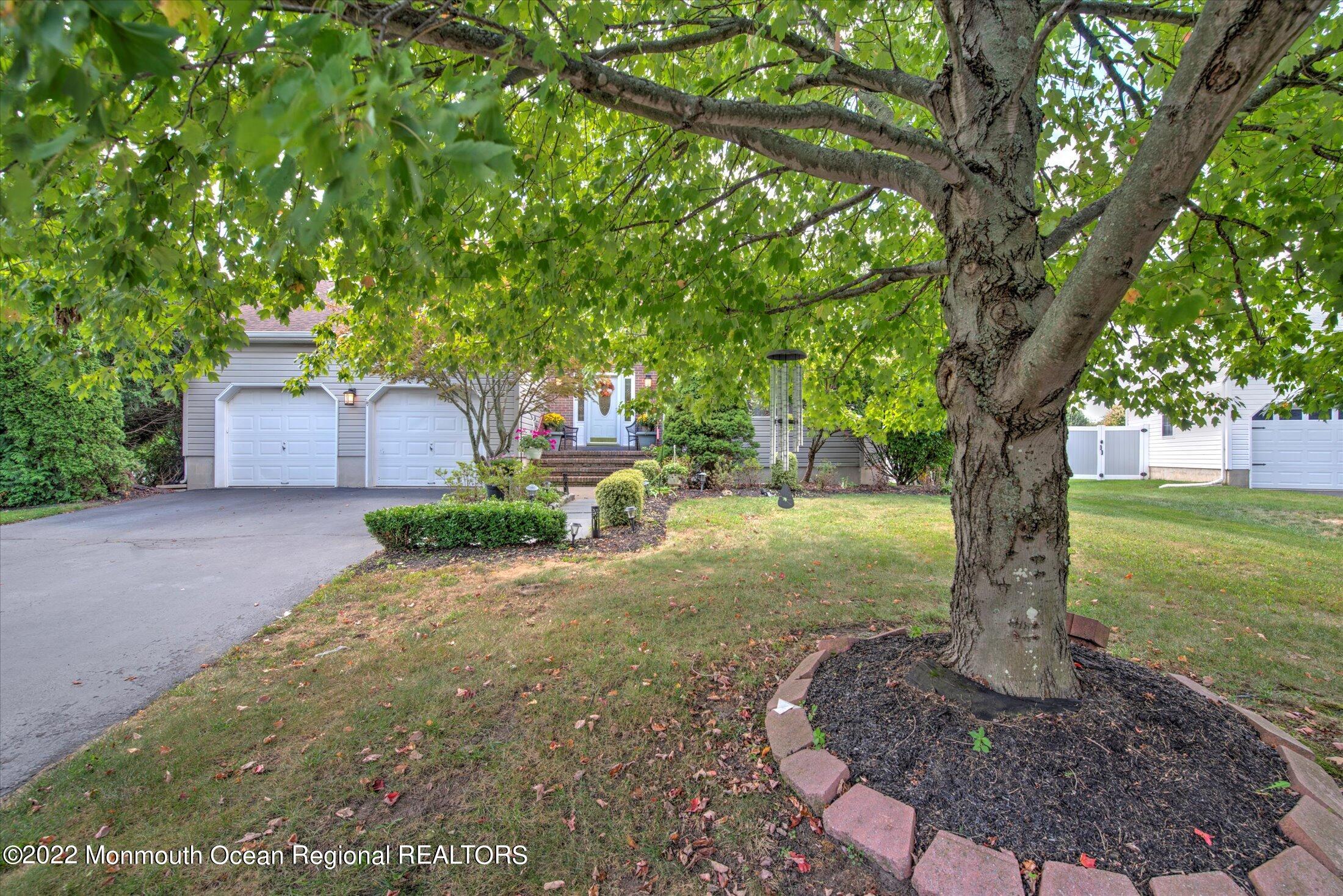 10 MacIntosh Court Jackson, NJ 08527 - Photo 2 of 49 a front view of a house with a yard