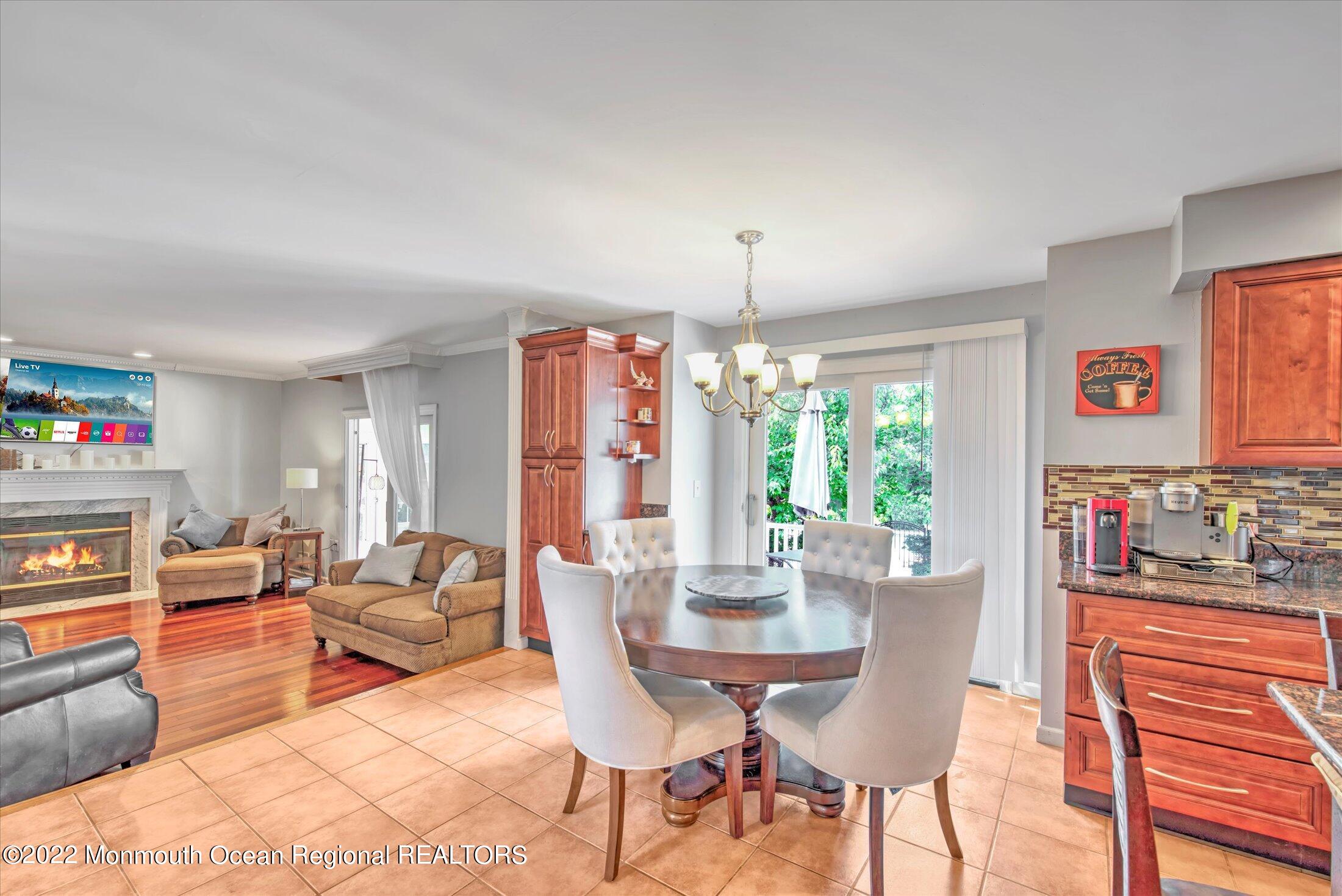 10 MacIntosh Court Jackson, NJ 08527 - Photo 24 of 49 a view of a dining room with furniture window and outside view