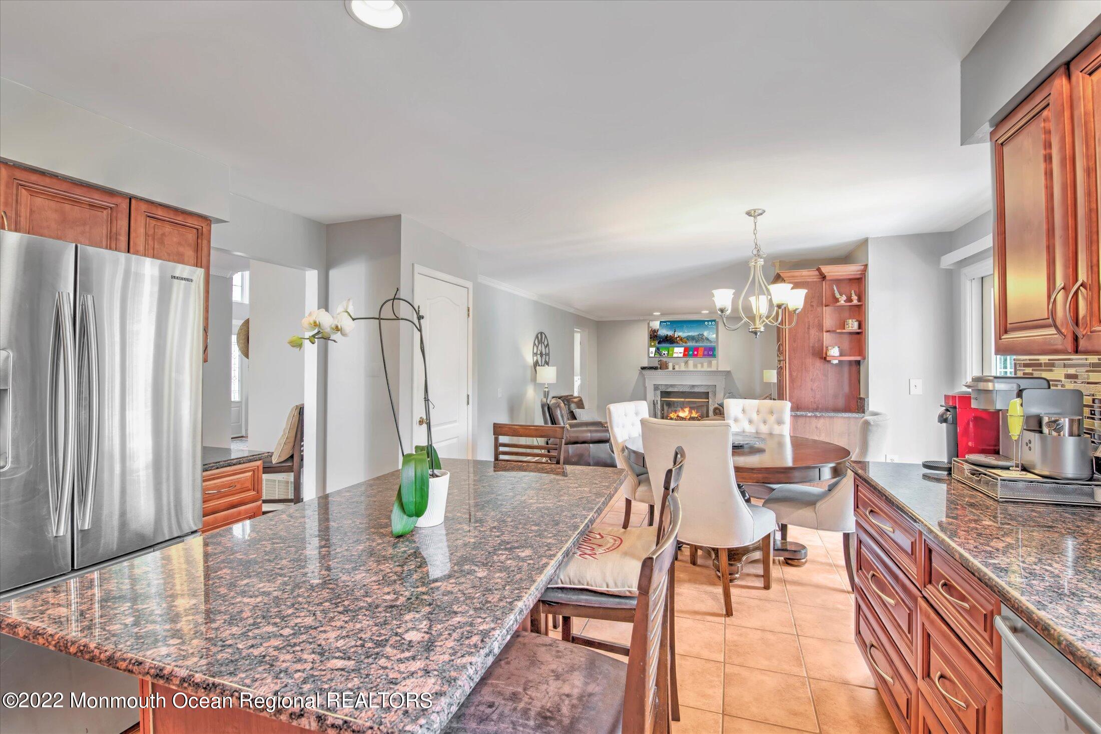 10 MacIntosh Court Jackson, NJ 08527 - Photo 28 of 49 a living room with dining table and a couch
