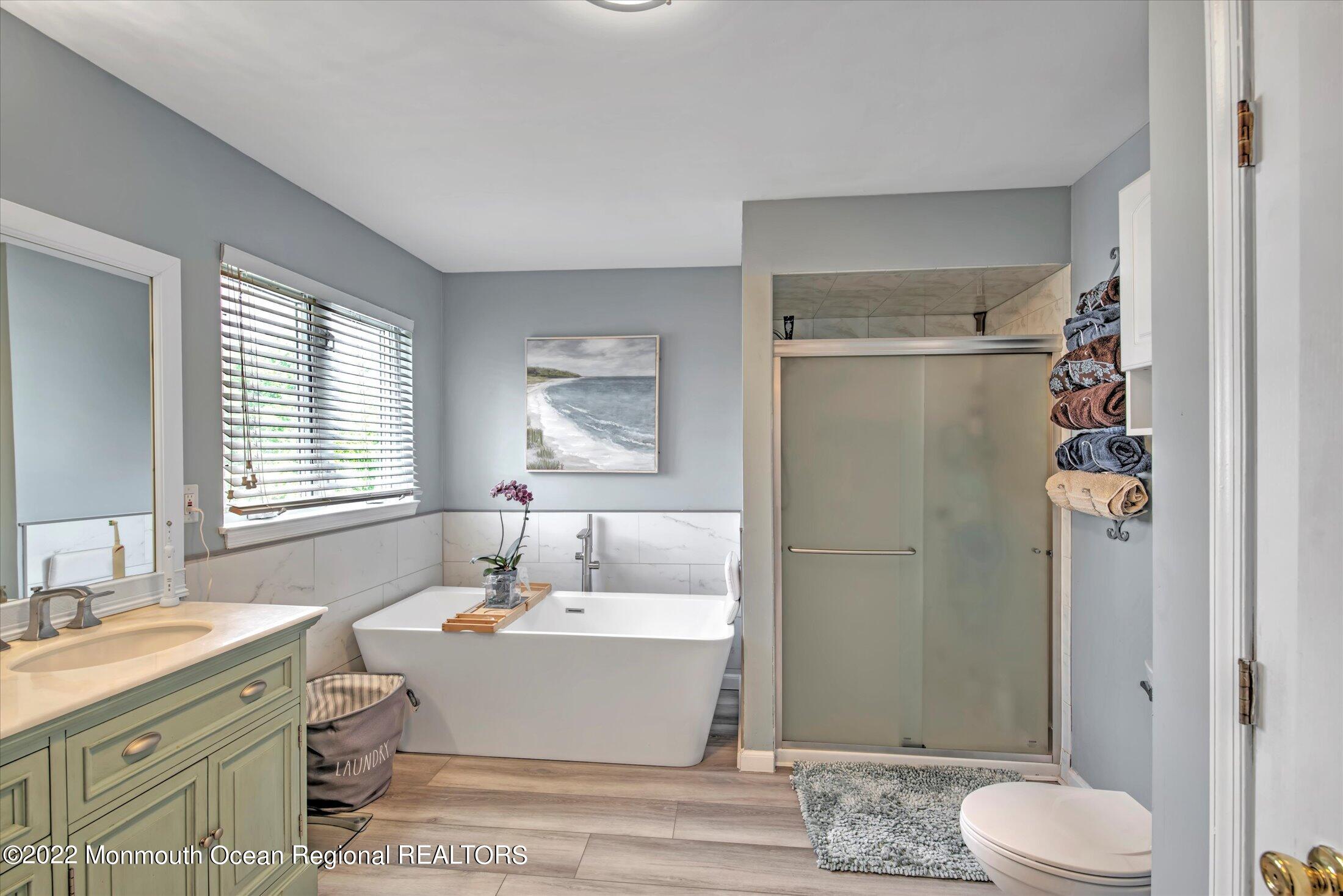 10 MacIntosh Court Jackson, NJ 08527 - Photo 35 of 49 a spacious bathroom with a granite countertop sink toilet and shower