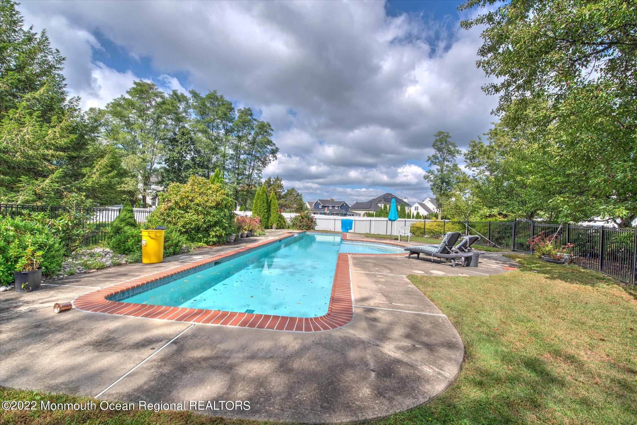 10 MacIntosh Court Jackson, NJ 08527 - Photo 46 of 49 a view of a swimming pool with a yard
