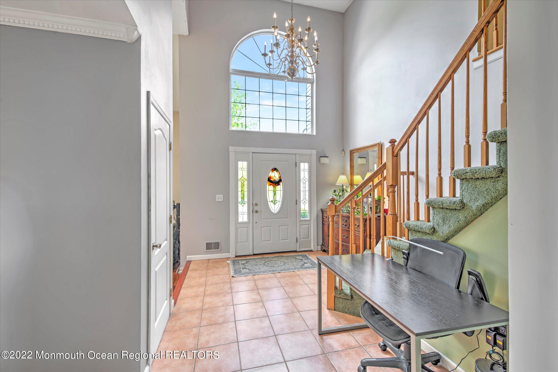 10 MacIntosh Court Jackson, NJ 08527 - Photo 6 of 49 a view of entryway and hall with wooden floor