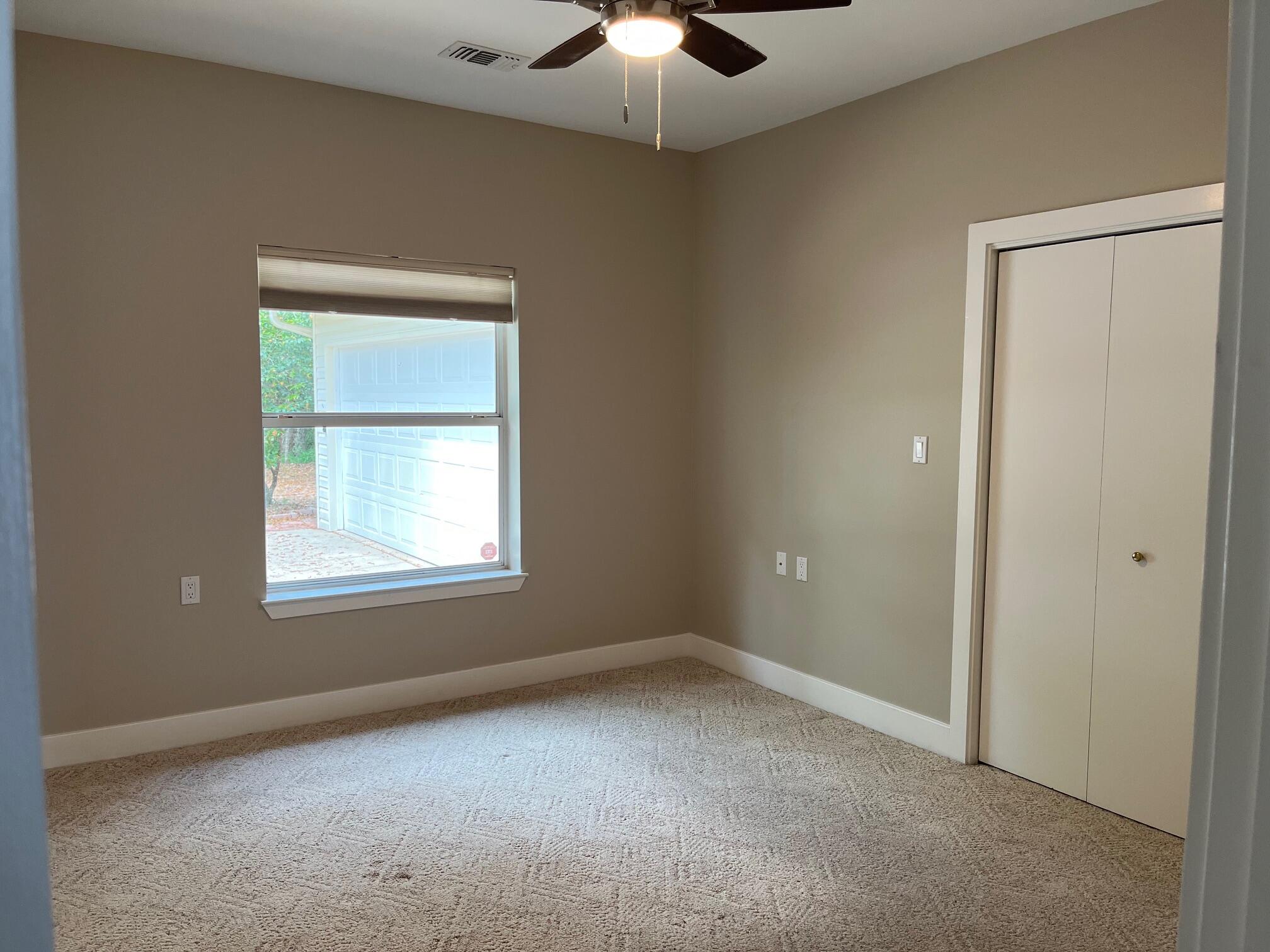 622 Nelson Point Road Niceville, FL 32578 - Photo 15 of 28 an empty room with a window and a fan