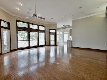 622 Nelson Point Road Niceville, FL 32578 - Photo 5 of 28 an empty room with wooden floor and windows
