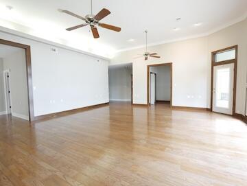 622 Nelson Point Road Niceville, FL 32578 - Photo 6 of 28 wooden floor in an empty room with a window