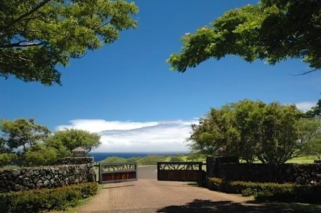 a view of a lake with a yard