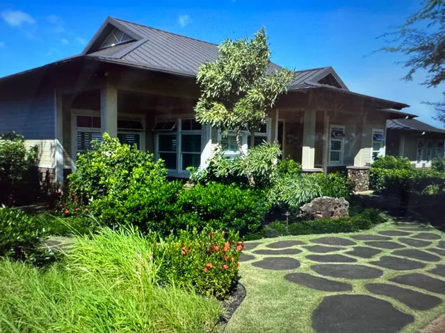 a living room with furniture and a ceiling fan