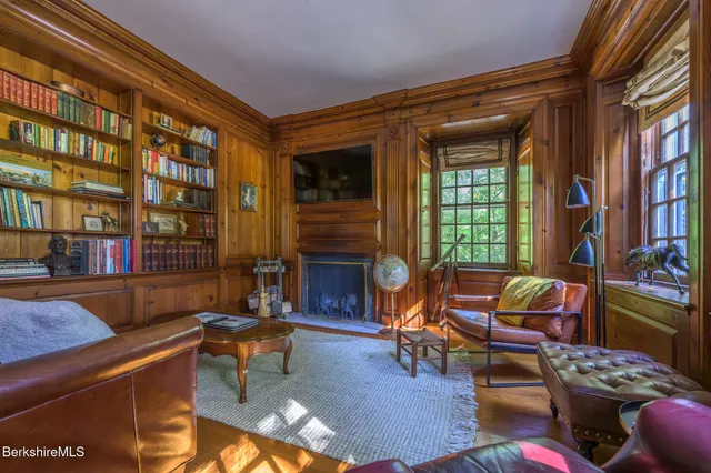 a view of a dining room with furniture and a livingroom