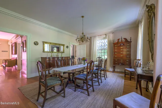 a bathroom with a toilet a sink and a mirror