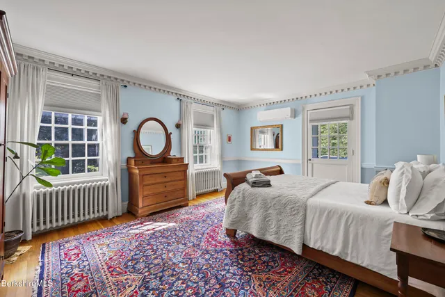 a bathroom with a sink toilet and mirror