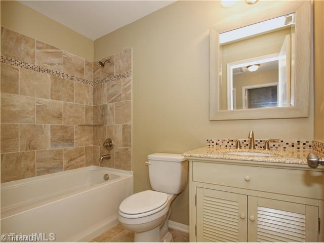 5110 Cheviot Road Greensboro, NC 27455 - Photo 11 of 16 Master Bath/Spa. The guest bath just received a full makeover, as well: Custom tile flooring and shower, granite vanity top, mirror and lighting!