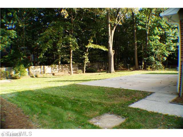 5110 Cheviot Road Greensboro, NC 27455 - Photo 15 of 16 Yard/Garden. The backyard has a large concrete patio for entertaining and has just received a makeover with trimmed trees and fresh grass!