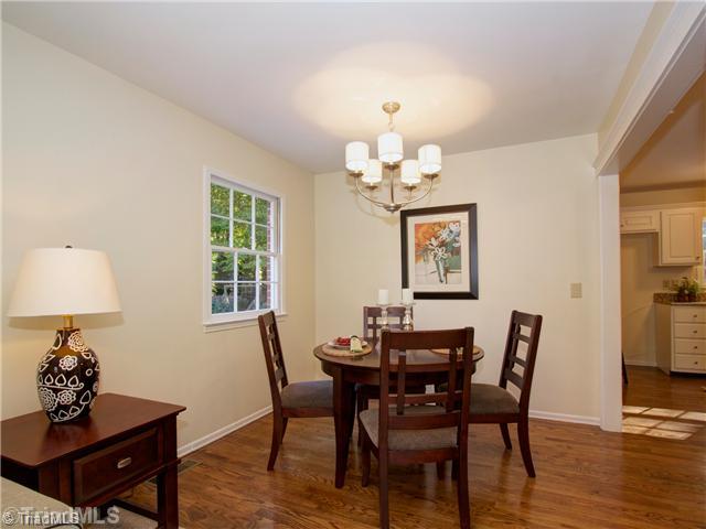 5110 Cheviot Road Greensboro, NC 27455 - Photo 6 of 16 Dining Room. The formal dining room features new hardwoods floors, updated formal lighting fixture, neutral paint and is a great place to entertain.