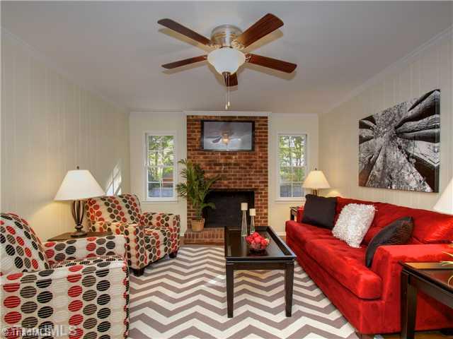 5110 Cheviot Road Greensboro, NC 27455 - Photo 8 of 16 Den/Family/Great Room. Fresh paint, refinished and gleaming hardwoods, wood burning fireplace and new lighting all await you!