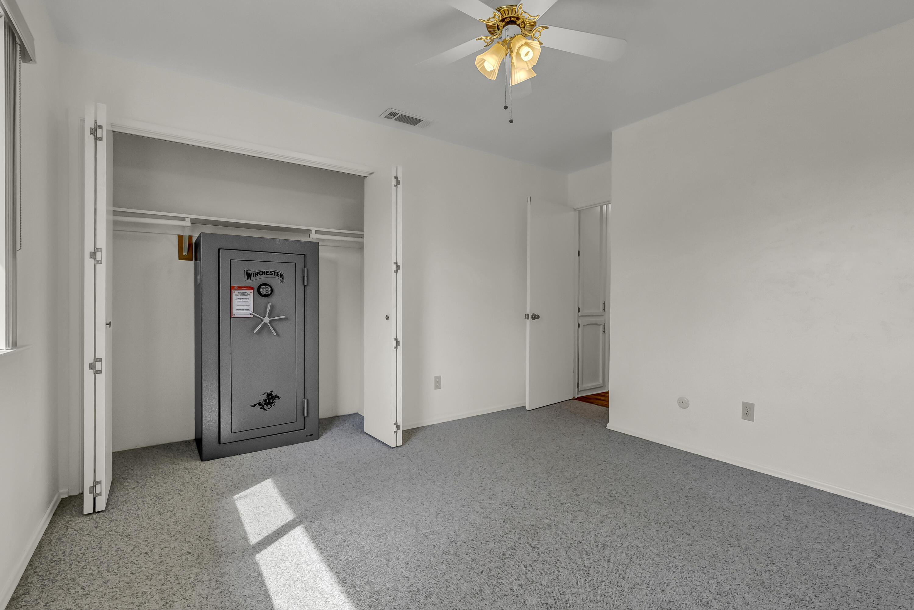 18002 320th Road Springville, CA 93265 - Photo 34 of 56 an empty room with a chandelier fan and closet