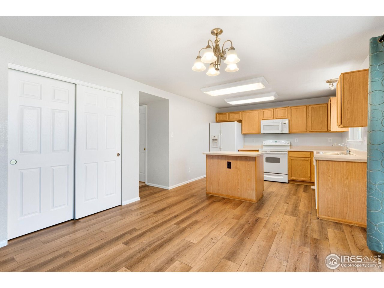 5415 Wolf Street Frederick, CO 80504 - Photo 12 of 29 a view of a kitchen with wooden floor