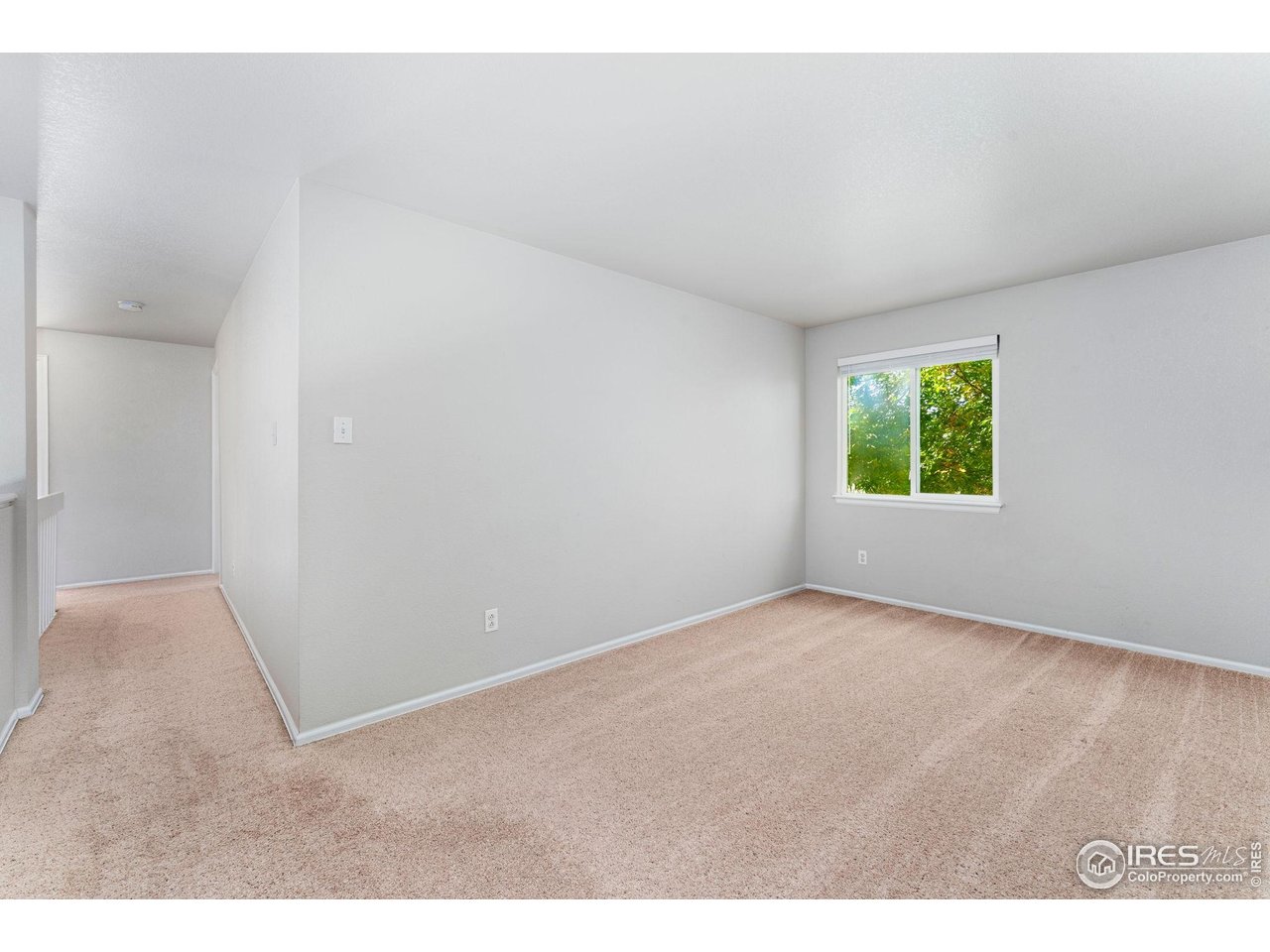 5415 Wolf Street Frederick, CO 80504 - Photo 17 of 29 a view of an empty room with a window