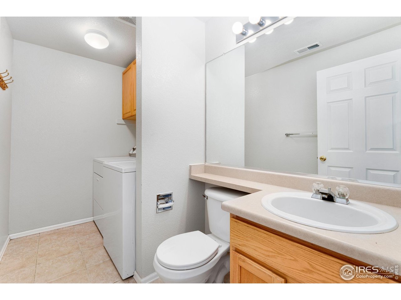 5415 Wolf Street Frederick, CO 80504 - Photo 19 of 29 a bathroom with a sink toilet and mirror