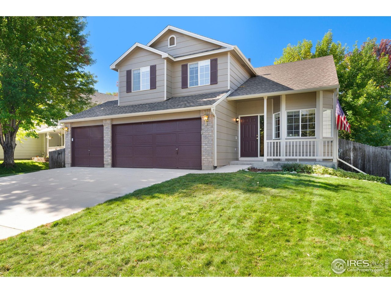 5415 Wolf Street Frederick, CO 80504 - Photo 2 of 29 a front view of a house with a yard and garage
