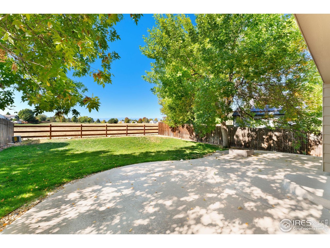 5415 Wolf Street Frederick, CO 80504 - Photo 26 of 29 a view of road with grass and a trees