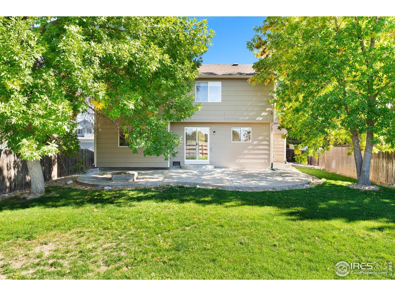 5415 Wolf Street Frederick, CO 80504 - Photo 27 of 29 a view of a house with a yard porch and sitting area